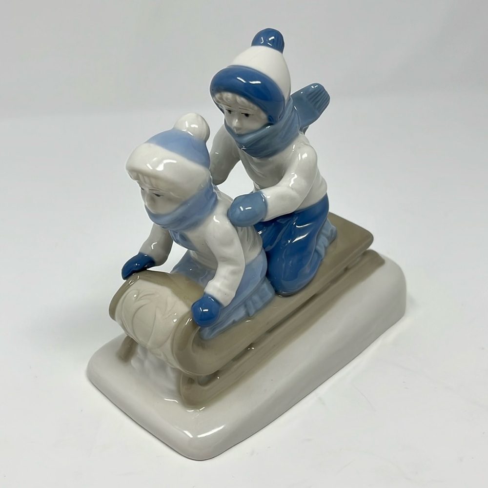 Porcelana De Cuernavaca Mexico Sledding Children Figurine